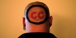 Back of a head shaved except for letters 