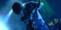 Jonny Greenwood from Radiohead playing guitar onstage