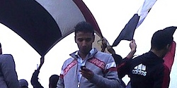 Man tweeting in Tahrir Square